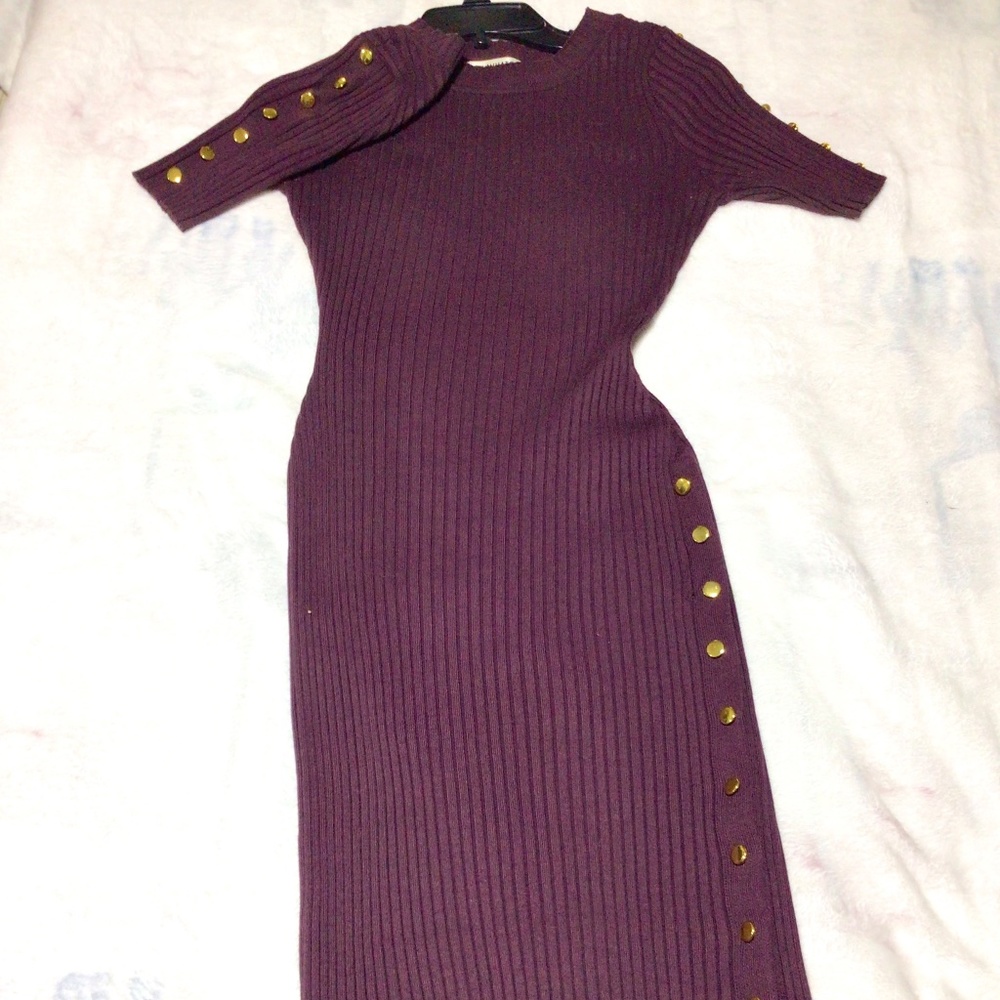 Purple dress below the knee with gold button detail on shoulder and up the leg.